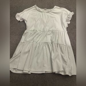 White small shirt. Never worn. No tags